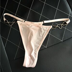 Pink thong with gold heart straps